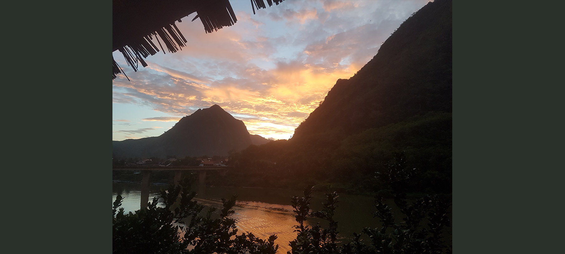 Sunset over Nam Ou River and Nong Khiaw from Nong Kiau Riverside